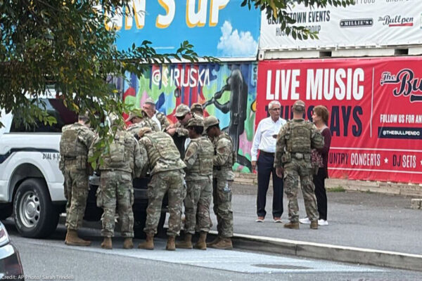 A group of National Guard troops speaking to DC civilians.