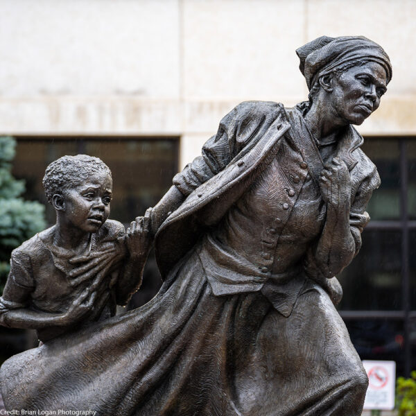White Plains, NY - USA - April 3, 2022: Closeup of Wesley Wofford's 9 ft bronze sculpture, Harriet Tubman — The Journey to Freedom. Depicting Tubman leading a young enslaved girl to freedom.