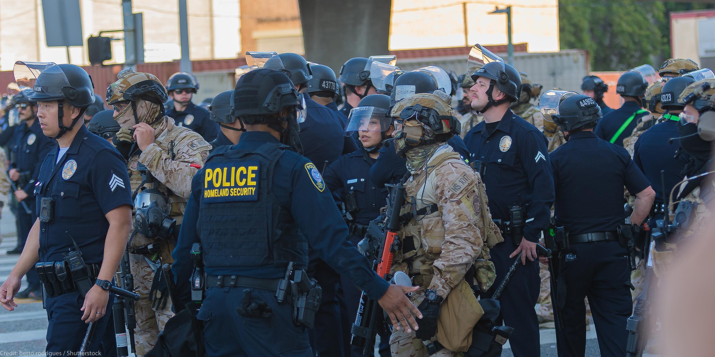 Border Patrol agents and police congregating during during a demonstration against expanded ICE operations and in support of immigrant rights.