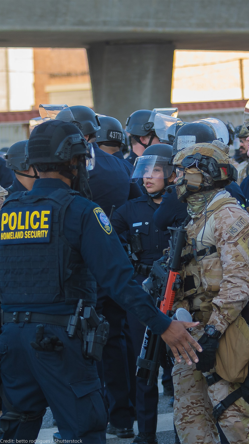 Border Patrol agents and police congregating during during a demonstration against expanded ICE operations and in support of immigrant rights.