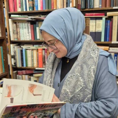 Rümeysa Öztürk reads an art book.