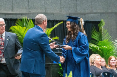 A photo of Mississippi student Zuri Wilson receiving her diploma at graduation.